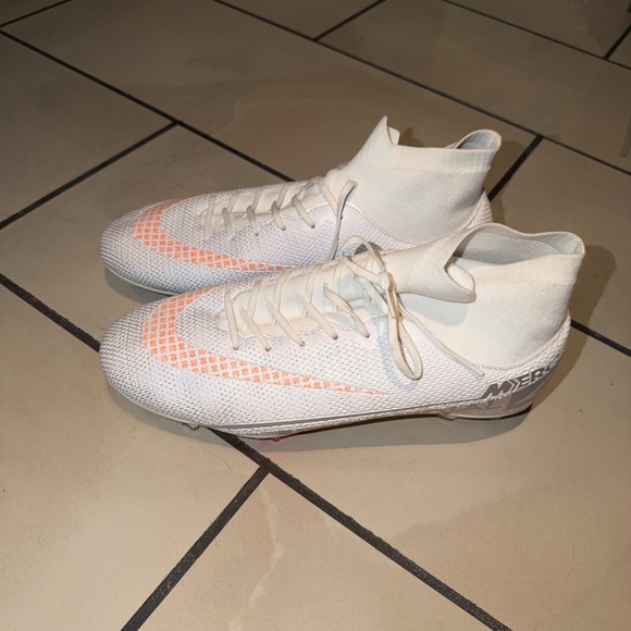 This is a pair of Nike Mercurial Superfly 6 Elite FG soccer cleats in white and